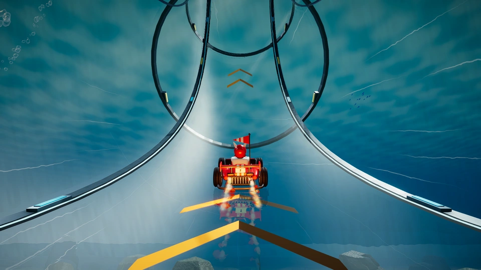 Formula kart boosting into the underwater loop on Abyss Circuit